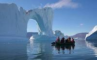 Zodiac boat cruise among icebergs in Antarctica